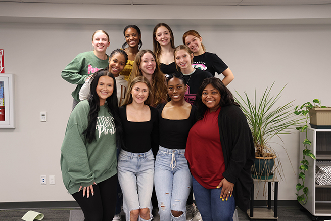 A group of students is photographed at a recognition event.